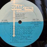 MOMENTS LOOK AT ME