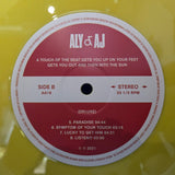ALY & AJ A TOUCH OF THE BEAT GETS YOU UP ON YOUR FEET YELLOW