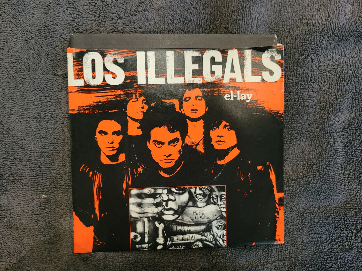 LOS ILLEGALS EL LAY PICTURE SLEEVE EN ESPANOL SPANISH VERSION